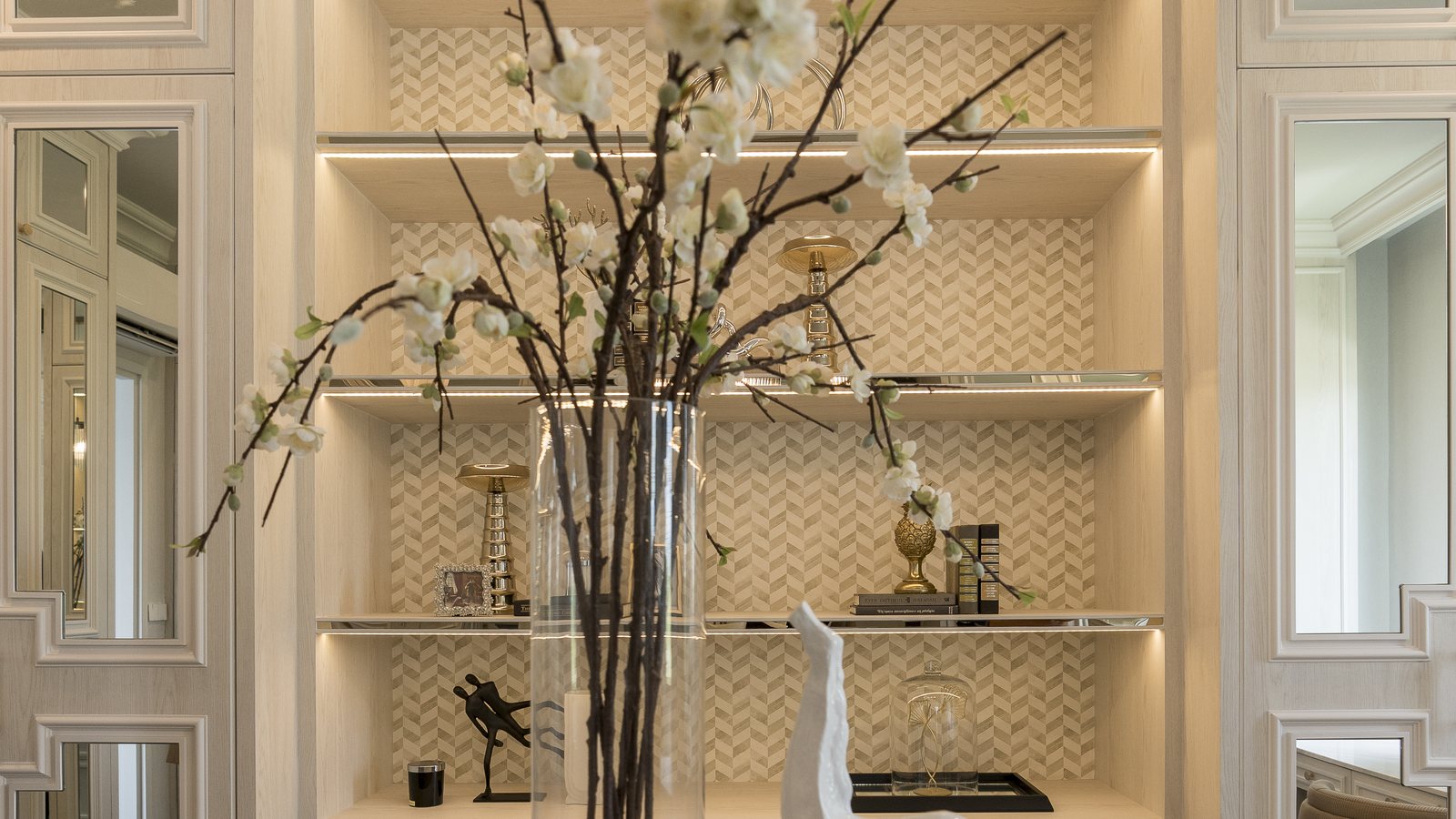 Built-in shelving and a tall vase