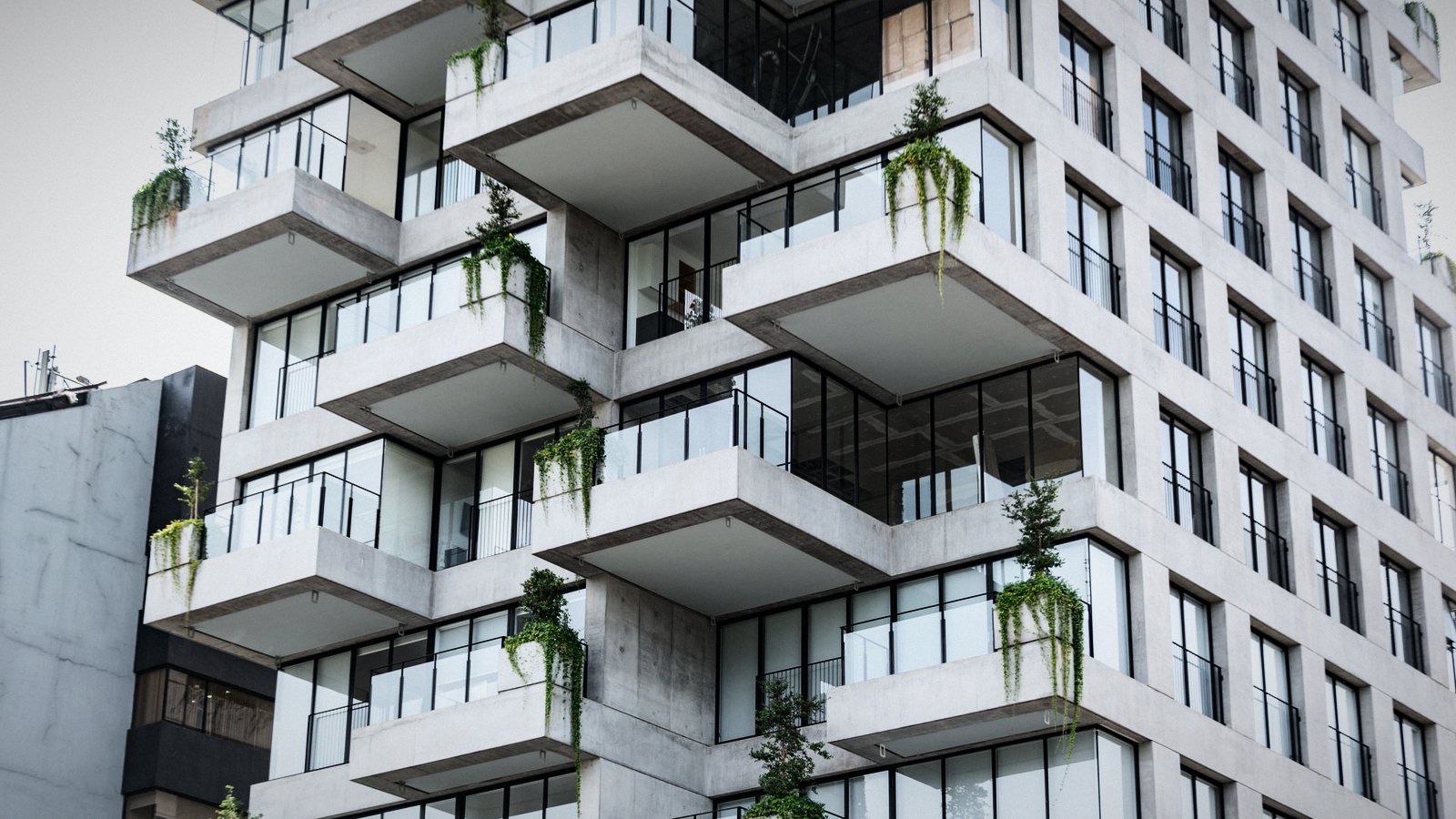 A residence of stacked cantilevered terraces, planting trailing over each edge