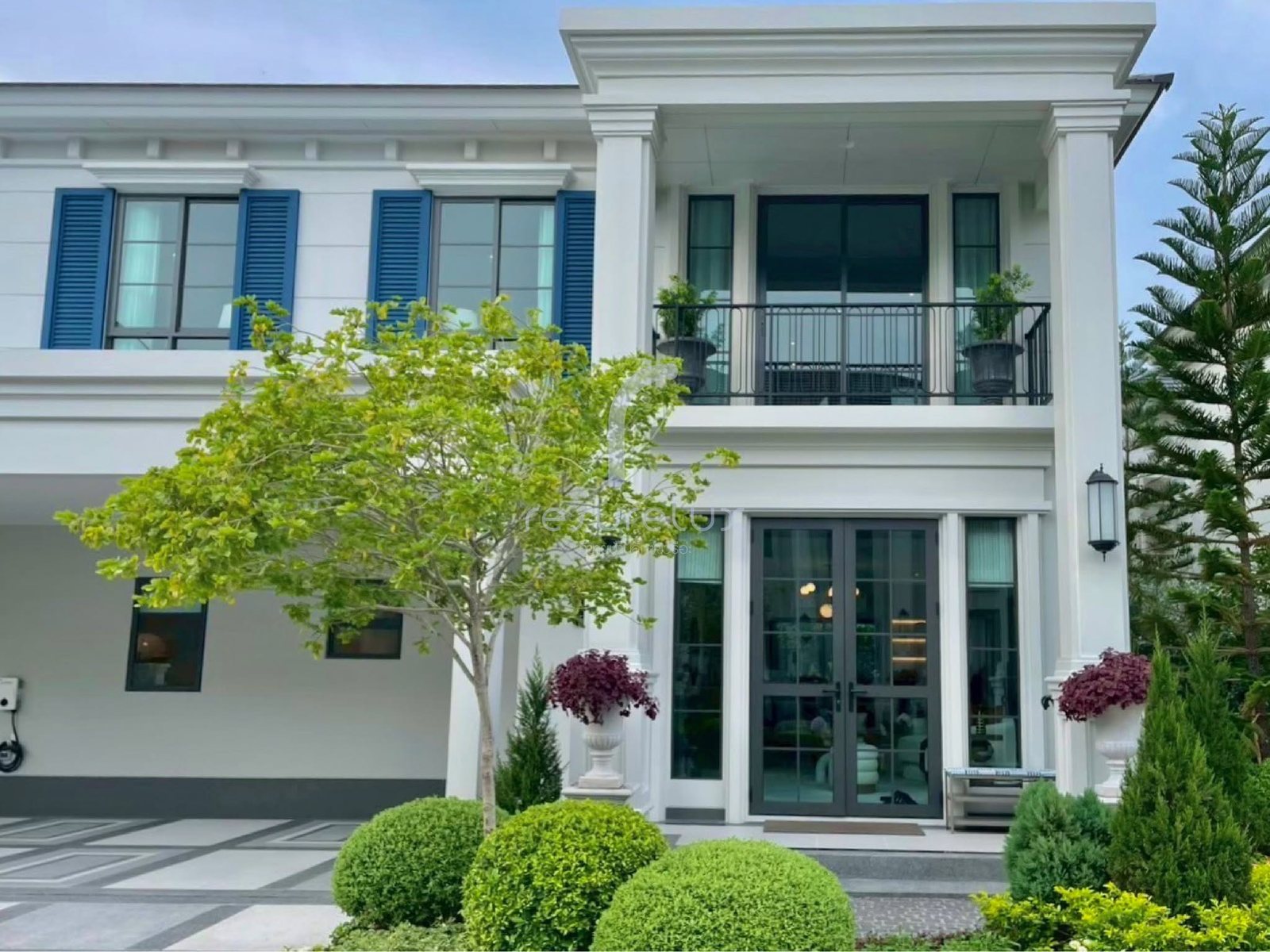 Entrance elevation with mature planting